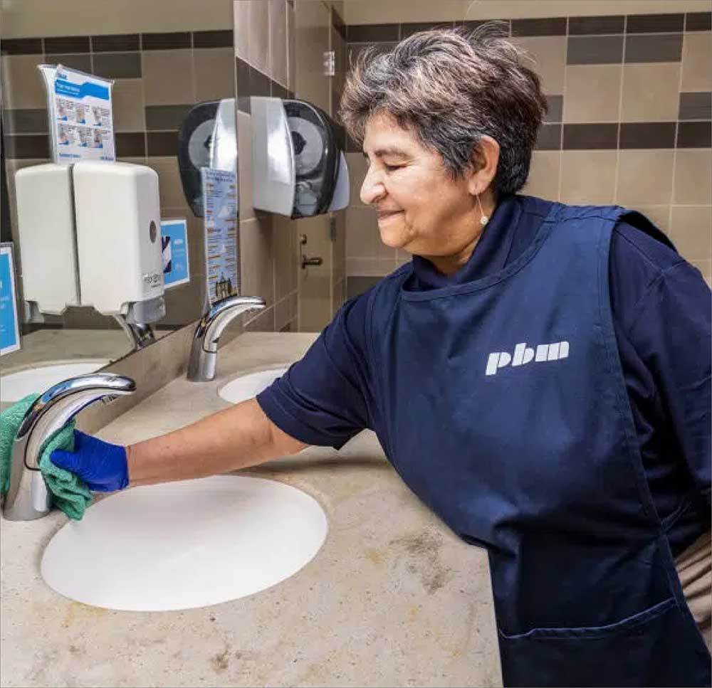 Woman Cleaning Toilet Drain Fredericksburg, VA